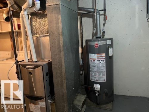 Tempstar furnace and Rheem water heater - 6117 120 Avenue, Edmonton, AB - Indoor Photo Showing Basement