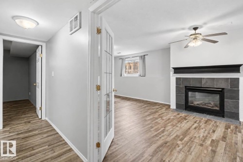 1 Deer Park Road, Spruce Grove, AB - Indoor Photo Showing Living Room With Fireplace