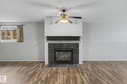 1 Deer Park Road, Spruce Grove, AB - Indoor Photo Showing Living Room With Fireplace