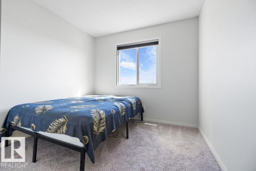 7123 46A Street, Beaumont, AB - Indoor Photo Showing Bedroom