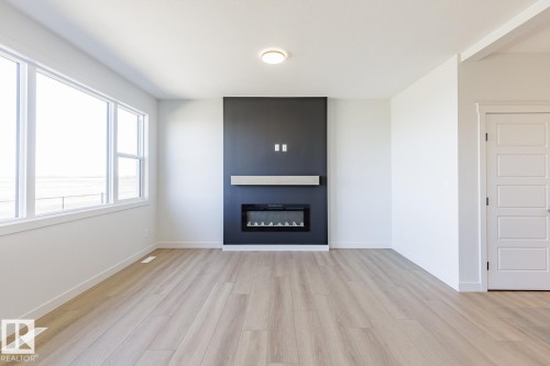 286 Lodge Pole Place, Leduc, AB - Indoor Photo Showing Living Room With Fireplace