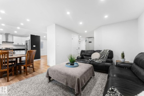 Open-concept living area with recessed lighting, wood-finish flooring, and a dining space - 362 Blackburn Drive E, Edmonton, AB - Indoor