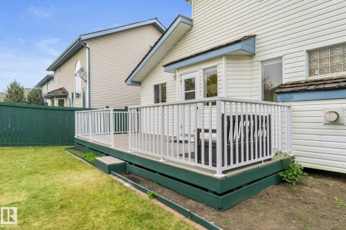 Rear deck featuring white railings and a green-painted base - 362 Blackburn Drive E, Edmonton, AB - Outdoor With Deck Patio Veranda With Exterior