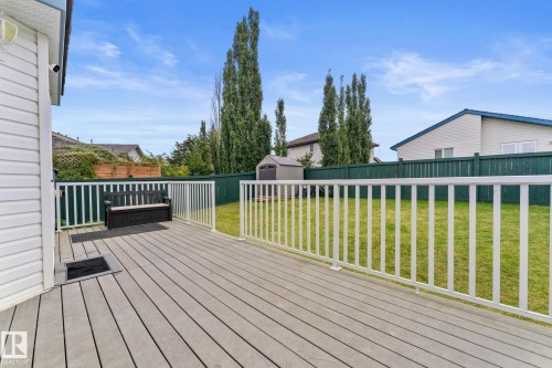 Spacious grey composite deck with white railings, offering outdoor living space - 362 Blackburn Drive E, Edmonton, AB - Outdoor With Deck Patio Veranda With Exterior
