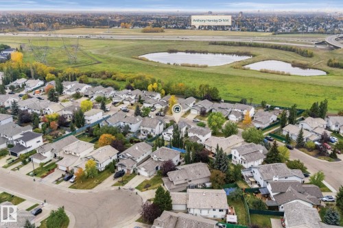 Residential neighborhood featuring multiple single-family homes with gray roofs and varied landscaping - 362 Blackburn Drive E, Edmonton, AB - Outdoor With View
