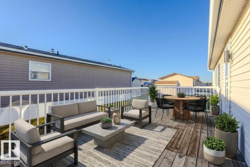 This photo is virtually staged using AI. - 514 Maple Wood Crescent, Edmonton, AB - Outdoor With Deck Patio Veranda With Exterior