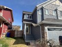 Two-story residence featuring a combination of horizontal siding, vertical siding, and stone veneer accents - 11 James Crescent, St. Albert, AB  - Outdoor 