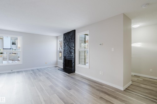 7032 Mill Woods Road, Edmonton, AB - Indoor Photo Showing Other Room With Fireplace