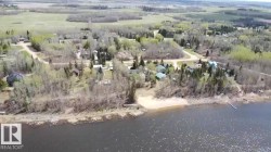 Waterfront community featuring natural landscaping and a private dock - 