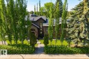 Multi-story residence featuring a dark exterior facade and an arched brick entryway - 11908 41A Avenue, Edmonton, AB  - Outdoor 