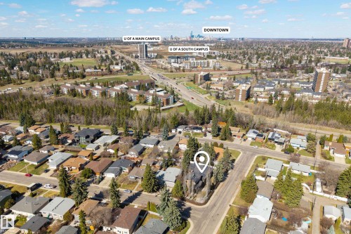 Aerial overview of a residential neighborhood with surrounding mature trees - 11908 41A Avenue, Edmonton, AB - Outdoor With View