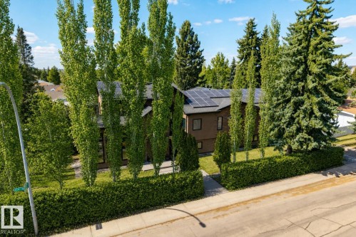 Contemporary-style residence featuring a dark brown exterior and a dark-toned roof - 11908 41A Avenue, Edmonton, AB - Outdoor