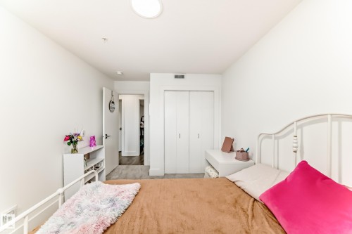 This room features a neutral color palette with white walls and a light-colored carpet - 307 9504 182 Street Nw, Edmonton, AB - Indoor Photo Showing Bedroom