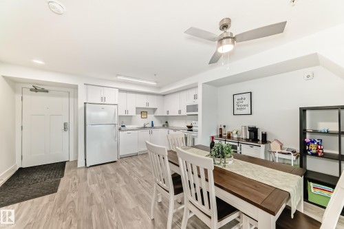 This living space features light-toned flooring and white walls, creating a bright atmosphere - 307 9504 182 Street Nw, Edmonton, AB - Indoor