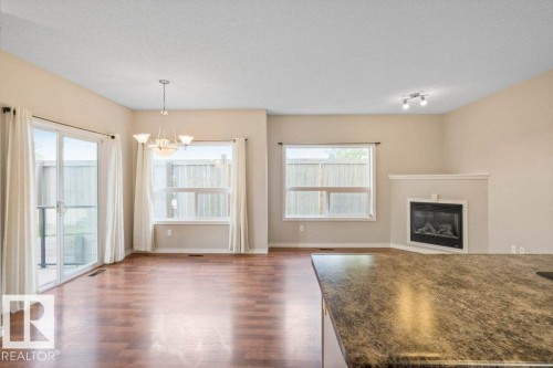 59 3010 33 Avenue, Edmonton, AB - Indoor Photo Showing Living Room With Fireplace