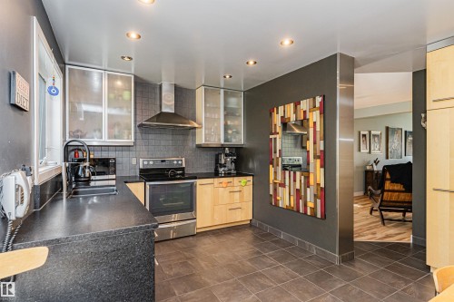 Contemporary kitchen featuring dark gray walls and floor tiling - 1235 104 Street, Edmonton, AB - Indoor Photo Showing Kitchen