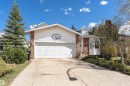 Split-level residence featuring a two-car garage, white siding, and brick accents - 1235 104 Street, Edmonton, AB  - Outdoor 