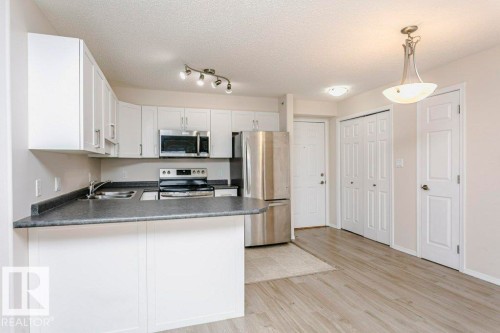423 13625 34 Street, Edmonton, AB - Indoor Photo Showing Kitchen With Stainless Steel Kitchen With Double Sink