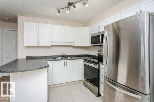 423 13625 34 Street, Edmonton, AB - Indoor Photo Showing Kitchen With Stainless Steel Kitchen With Double Sink