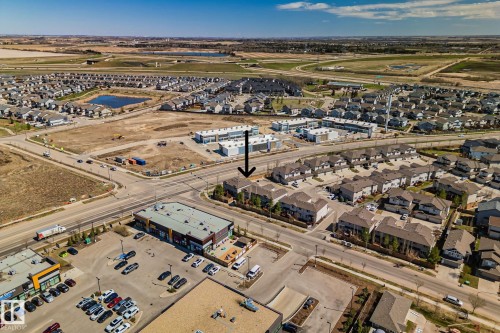 Aerial overview showcasing the property within a developed residential area - 46 445 Brintnell Boulevard, Edmonton, AB - Outdoor With View