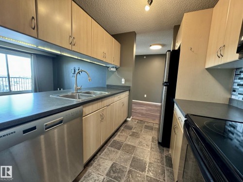 514 2430 Guardian Road, Edmonton, AB - Indoor Photo Showing Kitchen With Double Sink