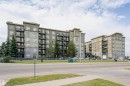 Contemporary apartment buildings featuring multi-story facades, extensive window arrays, and individual balconies - 1-402 4245 139 Avenue, Edmonton, AB  - Outdoor With Balcony With Facade 