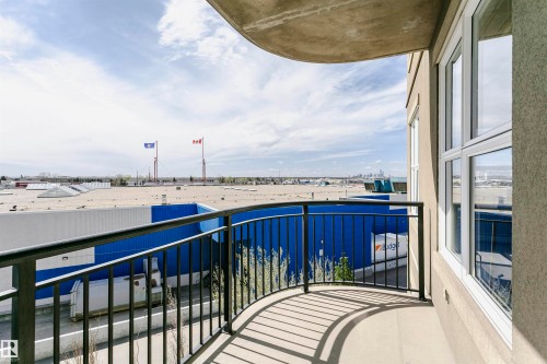 Curved balcony with black metal railing - 1-402 4245 139 Avenue, Edmonton, AB - Outdoor With Balcony With Exterior