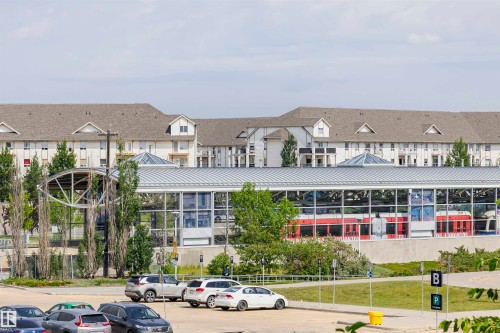 Multi-story residential building with dormer windows and a shingle roof - 1-402 4245 139 Avenue, Edmonton, AB - Outdoor