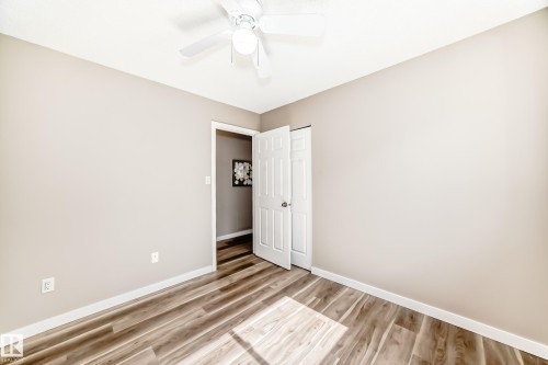 This room features wood-style flooring and a ceiling fan - 10327 150 Street, Edmonton, AB - Indoor Photo Showing Other Room