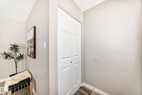 This property features light-colored walls and wood-look flooring - 10327 150 Street, Edmonton, AB - Indoor Photo Showing Other Room