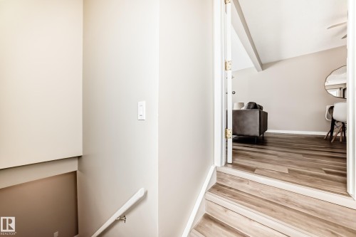 The property features light-colored walls and wood-look flooring - 10327 150 Street, Edmonton, AB - Indoor Photo Showing Other Room