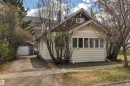 Craftsman-style exterior with cream siding and contrasting dark trim - 4907 48 Avenue, Leduc, AB  - Outdoor 