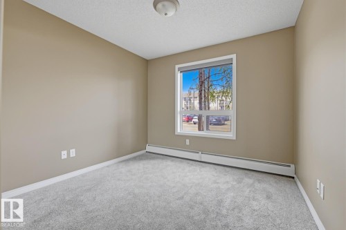 Bedroom featuring light gray carpet flooring and neutral wall tones - 5106 7335 South Terwillegar Drive, Edmonton, AB - Indoor Photo Showing Other Room