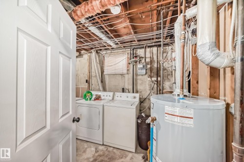 Utility area with exposed ceiling joists and concrete flooring - 3802 52 Street, Wetaskiwin, AB 