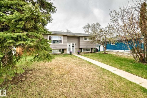 Split-level residence featuring gray siding and white trim - 3802 52 Street, Wetaskiwin, AB 