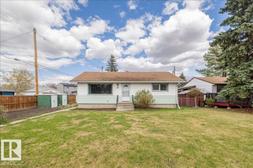 Single-story residence featuring a white and light green exterior with a brown shingle roof - 24 Elizabeth Drive, Fort Saskatchewan, AB - Outdoor
