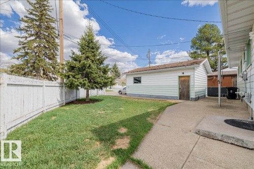 Detached garage with horizontal siding and a side entry door - 24 Elizabeth Drive, Fort Saskatchewan, AB - Outdoor