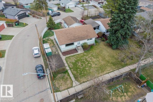 Single-story residence featuring a light-colored exterior and a brown shingle roof - 24 Elizabeth Drive, Fort Saskatchewan, AB - Outdoor
