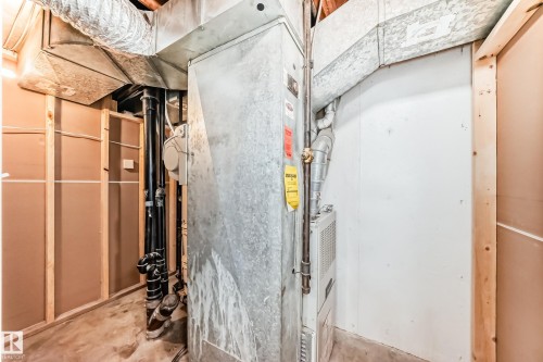 The property features a utility area with exposed ductwork, piping, and mechanical equipment - 10329 150 Street, Edmonton, AB - Indoor Photo Showing Other Room