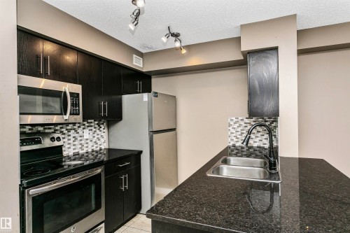 304 274 Mcconachie Dr Nw, Edmonton, AB - Indoor Photo Showing Kitchen With Double Sink