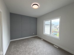Accent wall featuring decorative paneling - 