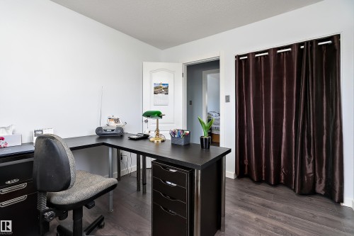 Room with dark wood-finish flooring, white walls, and a white interior door - 17 Camelot Avenue, Leduc, AB - Indoor Photo Showing Office