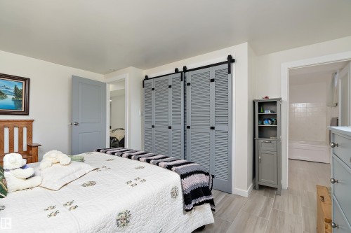 Bedroom featuring light wood-finish flooring and a white ceiling - 17 Camelot Avenue, Leduc, AB - Indoor Photo Showing Bedroom