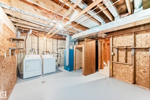 Unfinished basement featuring exposed wood joists and structural elements - 2578 138A Avenue, Edmonton, AB - Indoor Photo Showing Laundry Room