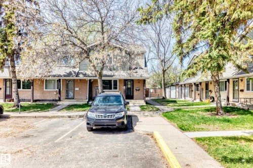 Multi-unit facade featuring light stucco and complementary siding - 2578 138A Avenue, Edmonton, AB - Outdoor With Facade