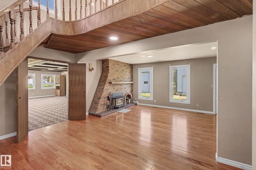 Hardwood flooring throughout the main room - 250 197 Avenue, Edmonton, AB - Indoor Photo Showing Other Room