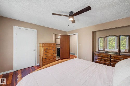 Room with wood-finish flooring, a ceiling fan with integrated lighting, and neutral wall paint - 250 197 Avenue, Edmonton, AB - Indoor Photo Showing Bedroom