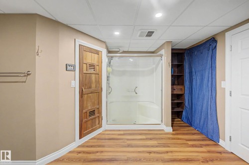 Sauna & Shower unit with glass enclosure and integrated seating - 250 197 Avenue, Edmonton, AB - Indoor Photo Showing Bathroom