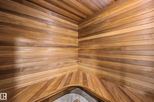 Wood-paneled interior featuring horizontal plank walls and ceiling - 250 197 Avenue, Edmonton, AB - Indoor Photo Showing Other Room
