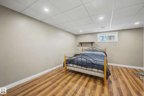 Interior room with wood-finish flooring and neutral wall tones - 250 197 Avenue, Edmonton, AB - Indoor
